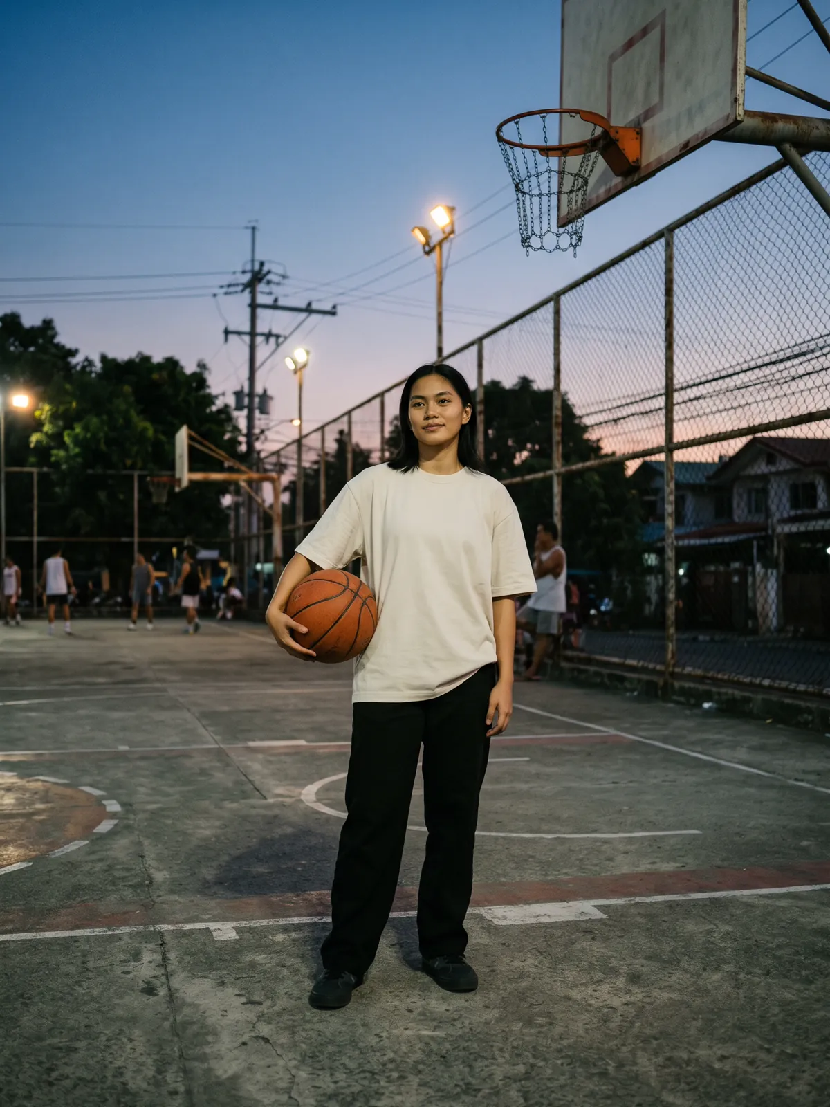 Model in the Bone Tee on a basketball court