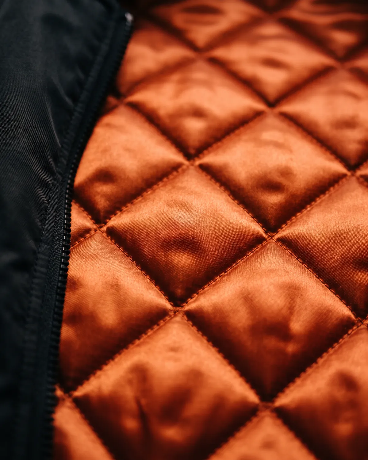 Close-up of orange quilted lining
